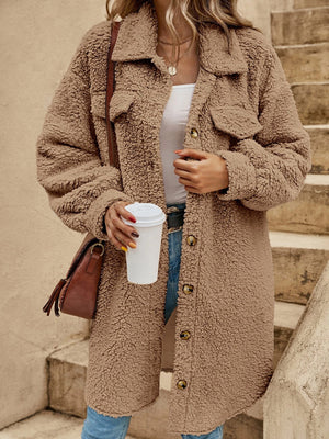 Womens plush fleece button front long coat in milky white, worn open over a knit