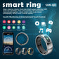 Black smart ring standing upright beside its round charging case