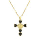 Gold tone cubic zirconia cross pendant necklaces shown side by side on a ceramic tray