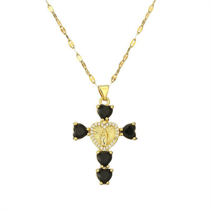 Gold tone cubic zirconia cross pendant necklaces shown side by side on a ceramic tray