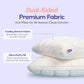 Two cream puff grid bed pillows stacked to show the quilted top and smooth side panel