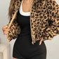 Cropped brown leopard vegan fur jacket with full front zip shown on a standing model