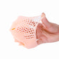 Foot wearing nude honeycomb forefoot pad with toes spaced by soft loops