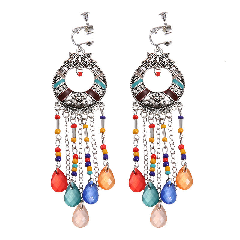 Vintage boho tassel clip-on earrings for non pierced ears, zinc alloy drop pair photographed on white background
