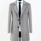 Detail of the notch lapel and single-breasted button front on the herringbone overcoat