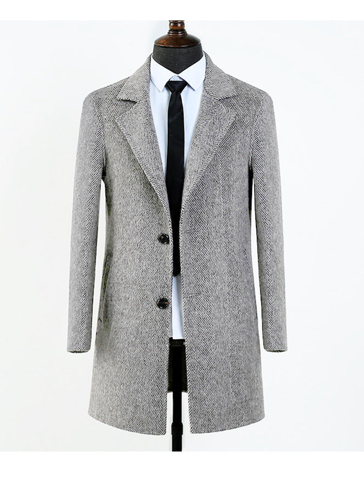Detail of the notch lapel and single-breasted button front on the herringbone overcoat
