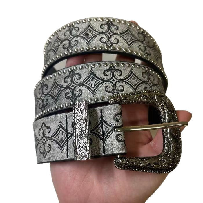 Back of the grey western belt showing the holes for the pin buckle and studded edges