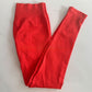 Chili red seamless leggings with the curved knitted seat panel visible on the flat lay