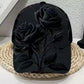 Flower print baseball cap with a curved peak resting on a neutral backdrop