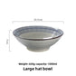 Angled hero shot of the Japanese style tokusa stripe ceramic noodle bowl