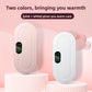 Pink and white heating belt units standing upright, each showing a green LED level display