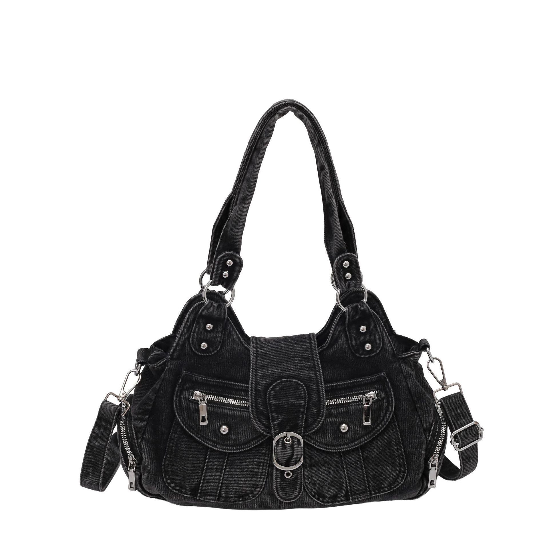 Black washed denim shoulder bag laid flat with buckle flap and silver studs