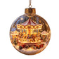 Clear Christmas ornament printed with a lit Christmas carousel, snowman and teddy scene