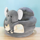 Grey plush baby floor seat with a penguin at the front and a soft padded ring to sit in