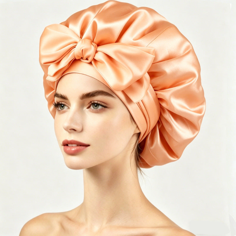 Satin sleeping bonnet with a smooth shiny face and a soft stretch band at the edge