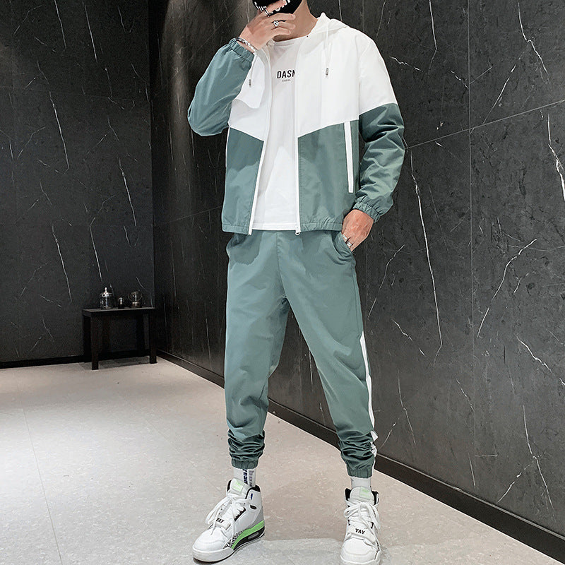 Hooded tracksuit set shown with companion sneakers in a styled context