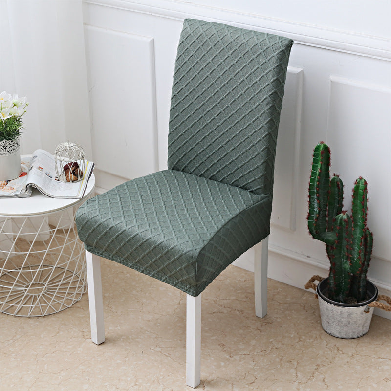 Set of dining chairs dressed in matching jacquard stretch covers