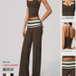 Model in a brown cropped camisole with a printed halter inset and wide leg pants, with three close up detail panels