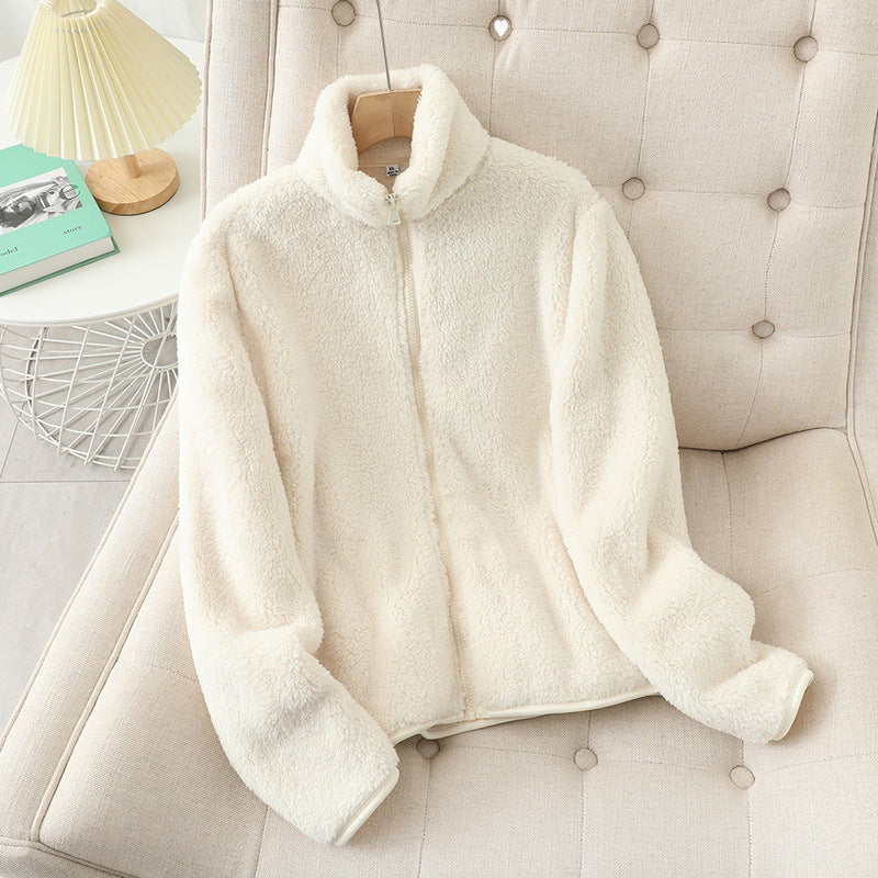 Cream white double sided plush fleece zip jacket with a tall stand collar laid flat