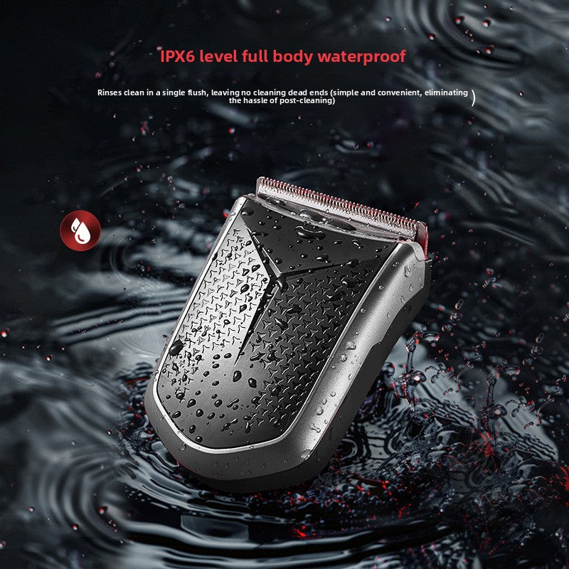 Compact dark hair clipper with a ridged grip splashed with water drops, with text about its IPX6 full body waterproof rating