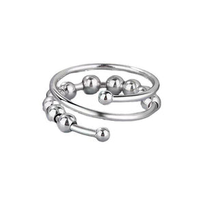 Adjustable copper spinner bead ring in gold tone with a row of free spinning round beads on the band