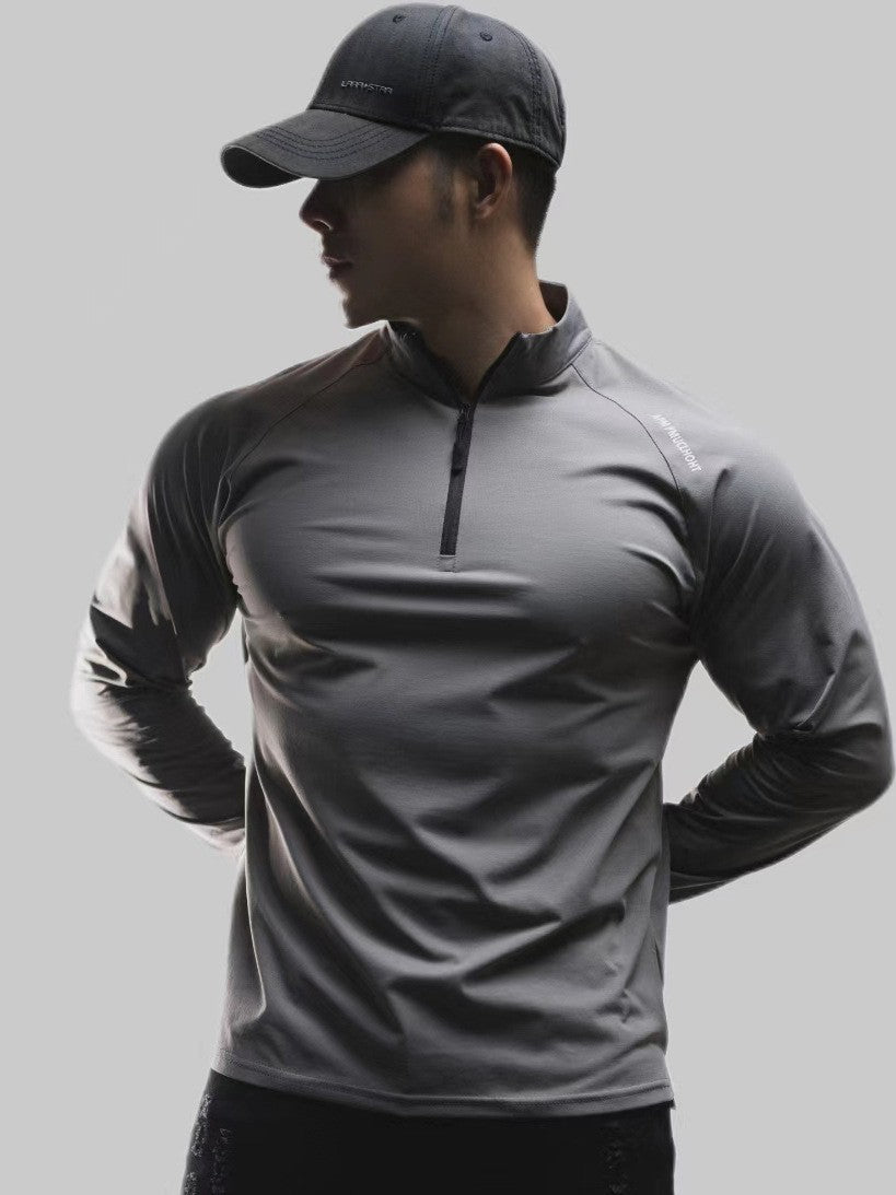 Half-zip sport shirt styled as a base layer under a jacket