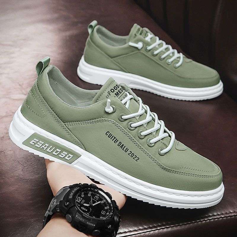 Green canvas low-top lace-up sneakers with white sole on a leather sofa, size 39 option photo