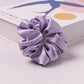 Pink satin scrunchie with white polka dots