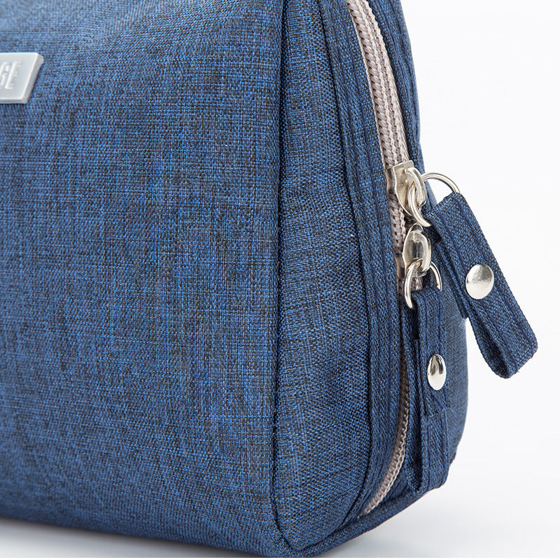 Water resistant toiletry bag with a wide top zip and a lined divided interior