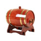 Amber wooden barrel dispenser with gold bands and a wooden spigot on a brown cradle
