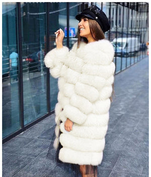 Woman wearing the long white vegan fur coat with a collarless round neckline and full sleeves