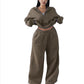 Army green cropped half-zip sweatshirt and wide-leg sweatpants set on a model, size M option