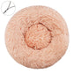 Dark beige round plush pet bed with a raised bolster rim on a plain background