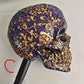 Splattered bone resin skull design for a punk motorcycle helmet wall rack