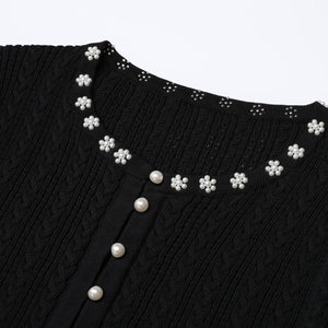 Knitted women's two-piece set seen from the side, showing the fit