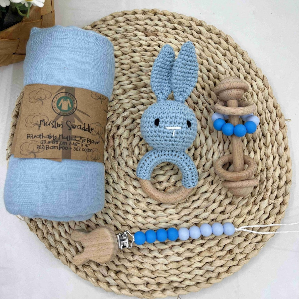 Crochet rattle and pacifier clip styled in an everyday baby scene