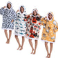 Four models wearing oversized hooded pullovers in leopard, shark, pumpkin and dog prints at 90 cm length