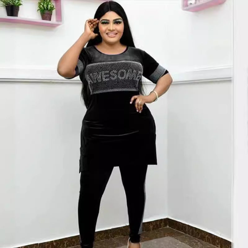 Velvet rhinestone two piece set with lettered top and matching leggings, shown on a model