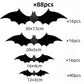 Black bat wall stickers of graduated sizes lined up on a light background
