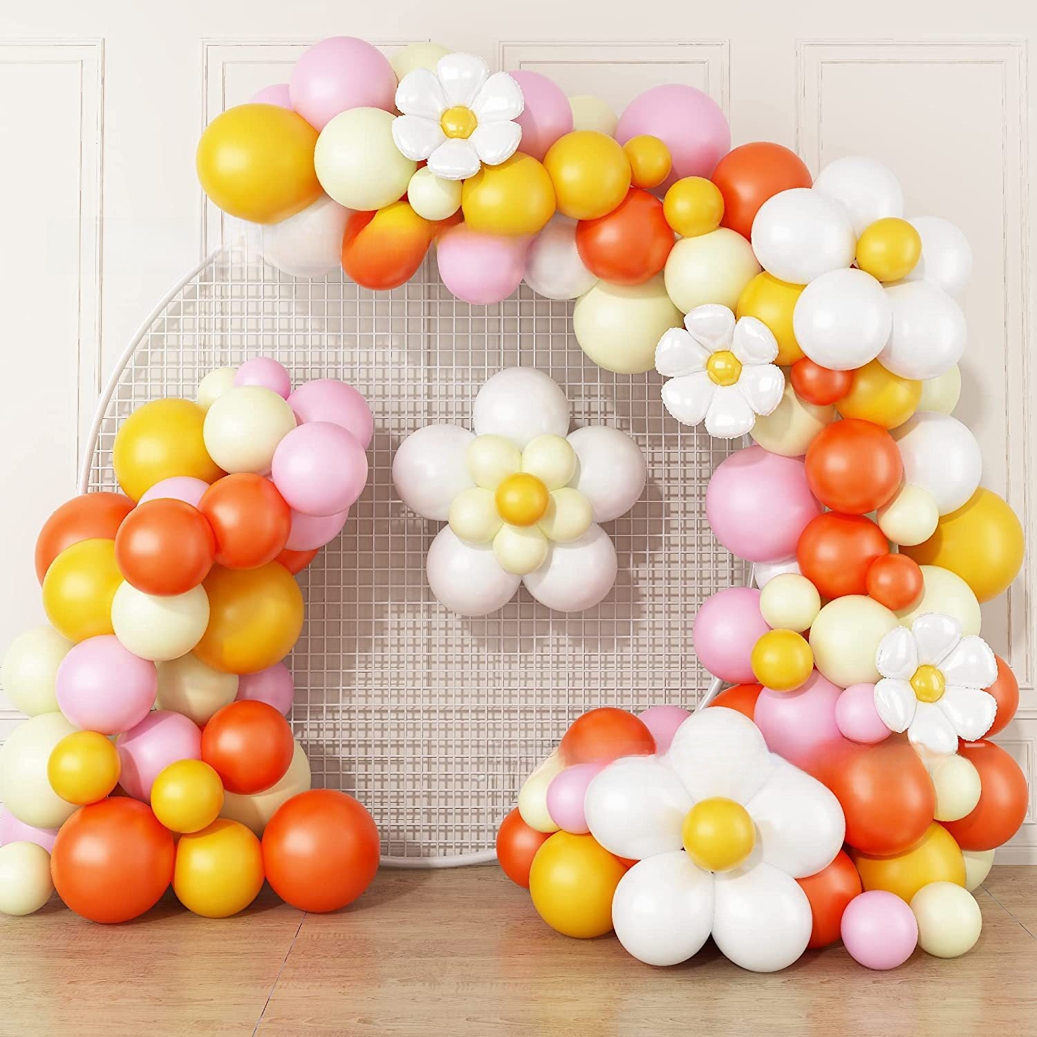 Mixed size pastel balloons grouped together to build a textured garland