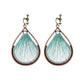 Bohemian tassel and bead clip-on drop earrings, aged tone zinc alloy frame, handmade pair on plain white background