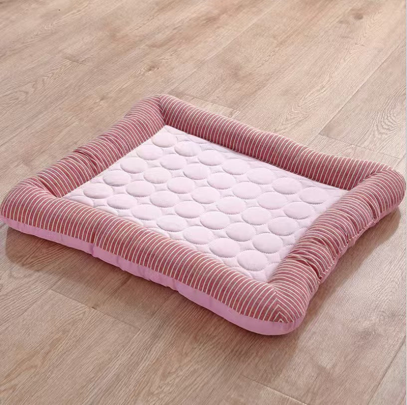 Cat stretched out flat on a sky blue ice silk cooling mat
