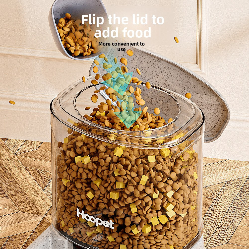 Gravity pet water dispenser with a clear tank refilling a bowl below