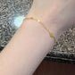 Top down view of the heart bracelet laid flat showing chain length and clasp