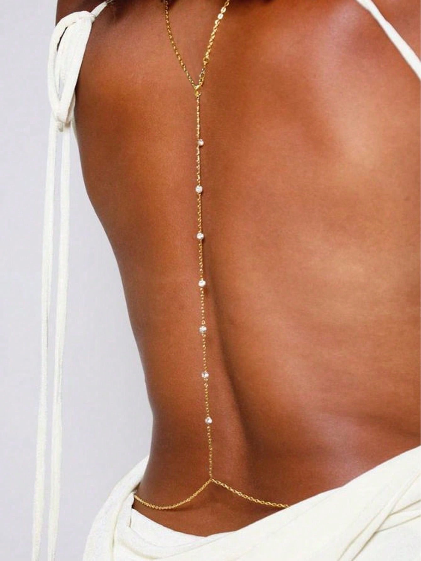 Back drape body chain worn low on a bare back