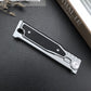 Closed folding pocket knife with aluminum frame and black textured panel, shown for the Gravity double front option