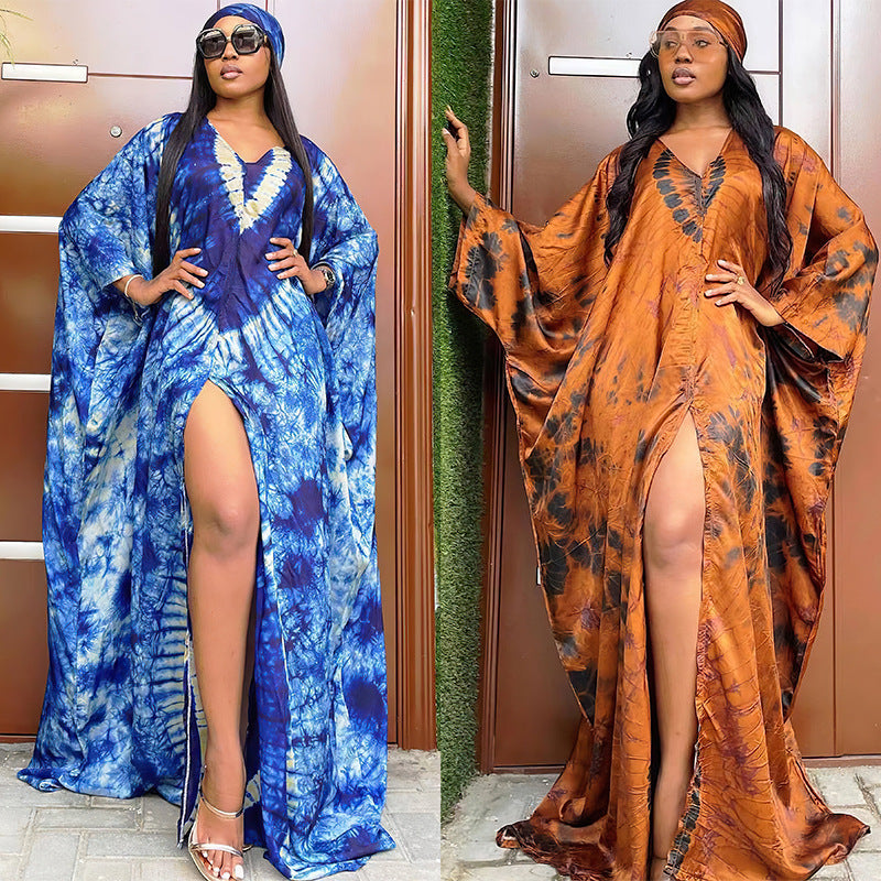 Tie dye satin finish kaftan maxi dress shown in blue and orange colorways on standing models