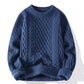 Neckline detail of the ribbed round crewneck on the cable knit pullover sweater