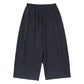 Loose-fitting sweatpants side profile showing relaxed tapered leg