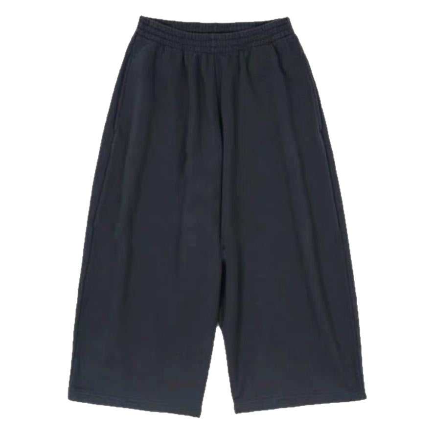 Loose-fitting sweatpants side profile showing relaxed tapered leg